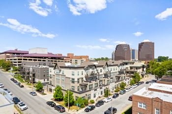 Exterior aerial view of The Mirabelle Luxury Apartments with street parking and parking garage access, close to public transportation. at Mirabelle Luxury Apartments, Kansas City 64111